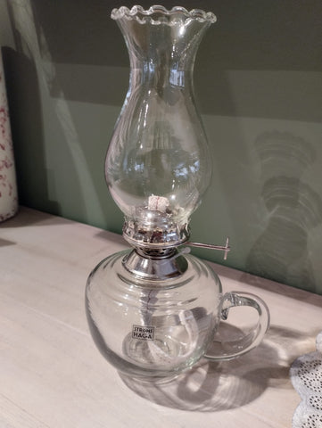 Fotogenlampa i klarglas med handtag